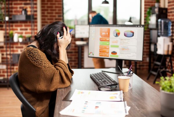 Woman resting in her head at office desk