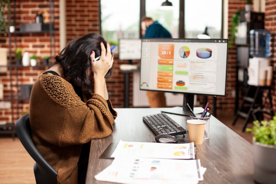 Woman resting in her head at office desk
